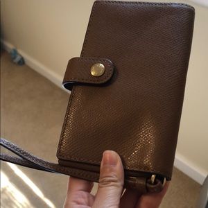 Brown Coach leather wristlet never used